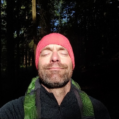 me, in a forest enjoying the sun